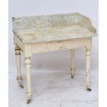 A late Victorian white painted marble topped wash stand.