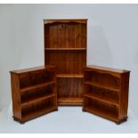 A tall modern pine open bookcase with adjustable shelves and two similar smaller examples (3).