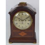 A large Edwardian mahogany inlaid and brass detailed eight day mantel clock,