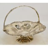 A William IV hallmarked silver circular fruit bowl with cast vines and grapes decorated rim and