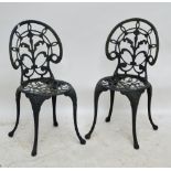 A pale blue bistro set comprising painted metal table and two folding chairs,