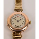 A 9ct rose gold lady's wristwatch, the inner case stamped "Rolex" and with a Rolex movement,