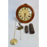 A late 19th century mahogany cased circular postman's alarm clock with painted dial set with Roman