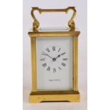 MAPPIN & WEBB LTD; a brass cased carriage clock with fluted corners and shaped handle,