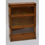 A mid 20th century oak three section Globe Wernicke stacking bookcase, width 86cm, height 120cm.