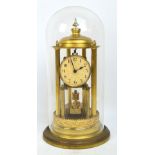 An early 20th century German Baduf mantel clock with circular dial set with Arabic numerals flanked