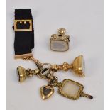 A 15ct yellow gold mounted ribbon suspending a Victorian heart shaped mourning locket with hair