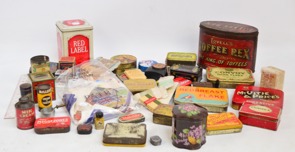 A collection of various advertising tins including Meggezones, Red Breast Flake,
