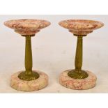 A pair of early 20th century French gilt metal and rose coloured marble side garnitures from a