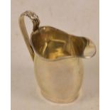 A George VI hallmarked silver helmet shaped cream jug with leaf capped loop handle, Lowe & Son,