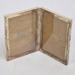 A Victorian hallmarked silver mounted hinged double photograph frame of plain rectangular form,