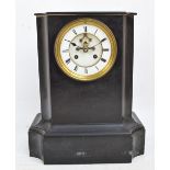 A late 19th century French black slate mantel clock with two-piece white enamel dial set with Roman