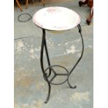 A reproduction wrought iron and ceramic wash stand with a large circular bowl and smaller attached