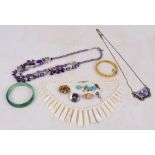 A small collection of costume jewellery including necklaces, gilt snap bangle,