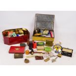 A mixed lot of collectors' items to include a group of advertising tins, an AA car badge,