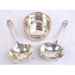 An Elizabeth II hallmarked silver tea strainer with finial decorated with a floral motif,