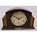 An Art Deco triple chime domed mantel clock, the circular silvered dial set with Arabic numerals,