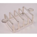 A George VI hallmarked silver four division toast rack of rectangular form with twin ornamental