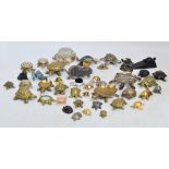 A collection of various metal figures of tortoises to include brass examples,