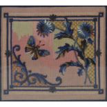 A Victorian beaded woolwork depicting a butterfly amongst thistles and foliate scrolls within