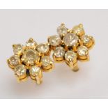 A pair of yellow metal diamond floral set ear studs, diameter approx 0.