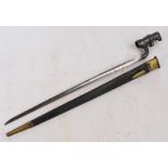 A Martini Henry spike bayonet with leather scabbard no.221, length 55cm.