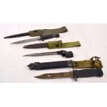 A WWI period bayonet with metal scabbard and leather belt loop,