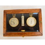 An early 20th century oak cased glazed display cabinet containing a Ross of London matching eight