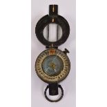 A military issued compass inscribed "T.G. Co Ltd London 1941 MK III" (af).