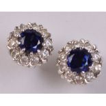 A pair of 18ct white gold Ceylon sapphire and diamond floral set ear studs, diameter approx 0.9cm.