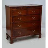 A late 19th century mahogany and inlaid chest of drawers with "secret" frieze drawer above two