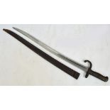 A late 19th century French chassepot bayonet with shaped scabbard and inscribed with date 1869 to