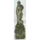 A composite stone statue of a lady in draped clothing carrying a ewer, set upon a decorated plinth,