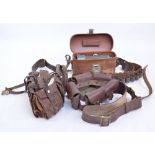 Three leather ammo belts and a leather cased Watts scope (4).