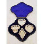 A cased set of four late Victorian hallmarked silver playing card suit dishes,