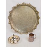 A large Eastern plated tray with bright cut decoration of domes and scrolling foliage,