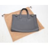 HERMES; a grey leather tote bag/document case with two handles and feature clasps,