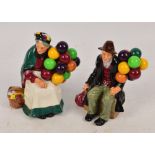 Two Royal Doulton figures; HN1315 "The Old Balloon Seller" and HN1954 "The Balloon Man" (af) (2).