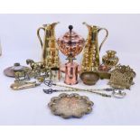 A quantity of metalware including a pair of brass jugs, a letter rack, a powder flask,