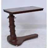 A late Victorian mahogany adjustable reading table with heavy ring turned end support and shaped