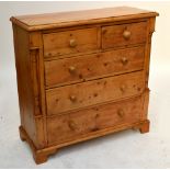 A Victorian pine chest of two short above three long drawers flanked by turned pillars,