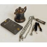 A rounded rectangular military issue gun cleaning kit and a Roger's silver plated lidded jug (2).