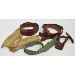 A brown Sam Browne military belt and another with a sword frog,