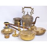 A group of brassware to include a large kettle with incised decoration, two warming pans,
