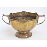 An Edwardian hallmarked silver twin handled pedestal bowl engraved with a lion rampant and