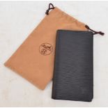 LOUIS VUITTON; a black leather wallet with textured exterior and sectioned interior, height 18cm,