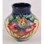 A modern Moorcroft squat vase decorated in the Arum Lily pattern, various painted marks to base,