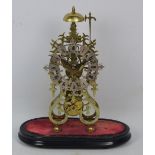 A late 19th century brass skeleton clock with silvered chapter ring set with Roman numerals and