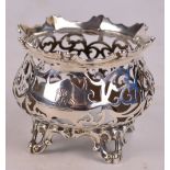 A Victorian hallmarked silver bowl frame of pierced design with shaped rim and crested cartouche,