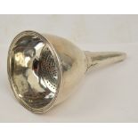 A George III hallmarked silver wine funnel of plain form with cast rim and conforming bowl with